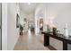 Inviting hallway with tiled floors and decorative accents leading to living spaces at 4080 Oaktree Dr, Davenport, FL 33837