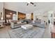 Open-concept living room featuring neutral decor, tile flooring, and a cozy seating arrangement at 4080 Oaktree Dr, Davenport, FL 33837