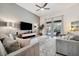 Comfortable living area showcasing tile flooring, neutral tones, and sliding doors to the patio at 4080 Oaktree Dr, Davenport, FL 33837