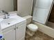 Updated bathroom features a white vanity and tiled shower at 4596 Pheasant Run Dr # C, Orlando, FL 32808