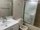 Cozy bathroom features a modern sink, frosted glass shower door, and neutral colored walls at 4596 Pheasant Run Dr # C, Orlando, FL 32808
