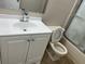 Cozy bathroom features a modern sink, frosted glass shower door, and neutral colored walls at 4596 Pheasant Run Dr # C, Orlando, FL 32808