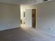 Carpeted bedroom features access to an ensuite bathroom at 4596 Pheasant Run Dr # C, Orlando, FL 32808