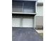 Exterior view of garage doors and building at 4596 Pheasant Run Dr # C, Orlando, FL 32808