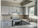 Bright kitchen showcases modern appliances, sleek countertops, and ample cabinet space at 4596 Pheasant Run Dr # C, Orlando, FL 32808
