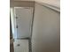 Landing at the top of the stairs featuring a tiled floor and a white door at 4596 Pheasant Run Dr # C, Orlando, FL 32808