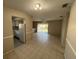 The living room features neutral color walls and tiled floors at 4596 Pheasant Run Dr # C, Orlando, FL 32808