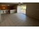 Bright living area featuring tile flooring, access to a balcony, and a cozy, open atmosphere at 4596 Pheasant Run Dr # C, Orlando, FL 32808