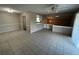 Expansive living area with ceramic tile flooring, ceiling fan, and soft, neutral wall tones at 4596 Pheasant Run Dr # C, Orlando, FL 32808