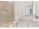 Modern bathroom featuring a glass-enclosed shower and white marble-topped vanity at 521 S Phelps Ave, Winter Park, FL 32789