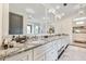 Bright bathroom with dual vanities, granite countertops, and a walk-in closet at 521 S Phelps Ave, Winter Park, FL 32789