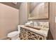 Stylish powder room with a unique vanity, modern fixtures, and decorative mirror at 521 S Phelps Ave, Winter Park, FL 32789