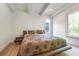 Minimalist bedroom with hardwood floors, a modern bed frame, and ample natural light at 521 S Phelps Ave, Winter Park, FL 32789