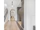 Bright hallway with hardwood floors, staircase, and custom built-in storage at 521 S Phelps Ave, Winter Park, FL 32789