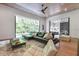 Expansive living room with a large sectional sofa and a seamless transition to the outdoor pool area at 521 S Phelps Ave, Winter Park, FL 32789