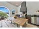 Outdoor dining area featuring a grill, kitchen area and large dining table at 521 S Phelps Ave, Winter Park, FL 32789