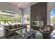 Relaxing outdoor lounge area with comfortable seating, a fireplace, and views of the surrounding landscape at 521 S Phelps Ave, Winter Park, FL 32789