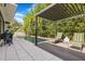 Inviting backyard pool area with an outdoor kitchen, a pergola-covered seating area, and lush bamboo landscaping at 521 S Phelps Ave, Winter Park, FL 32789