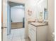 A bright bathroom with an open view into another room and a single sink at 5234 Bear Corn Run, Port Orange, FL 32128