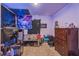 Cozy bedroom featuring dark decor, includes a dresser and comfortable sleeping space at 5234 Bear Corn Run, Port Orange, FL 32128