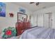 A bedroom with an ensuite bathroom and bright walls and ceiling fan at 5234 Bear Corn Run, Port Orange, FL 32128