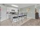 Bright kitchen featuring a breakfast bar with seating, stainless steel appliances, and ample counter space at 5234 Bear Corn Run, Port Orange, FL 32128