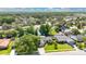 A captivating aerial view of a home with a pond nearby at 623 Tuskawilla Point Ln, Winter Springs, FL 32708