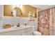 Well-lit bathroom featuring a stylish vanity with a round mirror and a shower with decorative curtain at 623 Tuskawilla Point Ln, Winter Springs, FL 32708