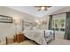 Inviting bedroom with a metal bed frame, natural light, and neutral decor at 623 Tuskawilla Point Ln, Winter Springs, FL 32708