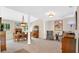 Bright dining room showcasing a chandelier, classic furniture, and ample natural light at 623 Tuskawilla Point Ln, Winter Springs, FL 32708