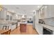 Modern kitchen with granite counters, stainless appliances, and an island at 623 Tuskawilla Point Ln, Winter Springs, FL 32708