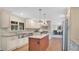 Bright kitchen featuring stainless steel appliances, a center island, and wood flooring at 623 Tuskawilla Point Ln, Winter Springs, FL 32708