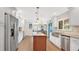 Bright, open kitchen with stainless steel appliances, island, and ample counter space at 623 Tuskawilla Point Ln, Winter Springs, FL 32708