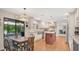 Bright eat-in kitchen boasts stainless steel appliances and a center island at 623 Tuskawilla Point Ln, Winter Springs, FL 32708