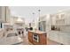 Spacious kitchen featuring stainless steel appliances and a functional center island at 623 Tuskawilla Point Ln, Winter Springs, FL 32708