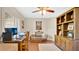 Inviting office space featuring a ceiling fan, built in bookcase, and a cozy seating area perfect for working from home at 623 Tuskawilla Point Ln, Winter Springs, FL 32708