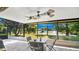 Covered screened patio with a serene view of the water fountain and the trees, ideal for relaxing and enjoying the view at 623 Tuskawilla Point Ln, Winter Springs, FL 32708