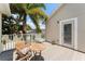Enjoy the outdoor balcony with views of the trees, yard, and surrounding community at 7003 Cupseed Ln, Harmony, FL 34773