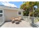 Relax on the deck featuring outdoor seating and views of the surrounding landscape at 7003 Cupseed Ln, Harmony, FL 34773