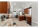 Kitchen with wood cabinets, tile backsplash, stainless steel appliances and granite countertops at 7003 Cupseed Ln, Harmony, FL 34773