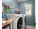 Laundry room with front-loading washer and dryer at 7003 Cupseed Ln, Harmony, FL 34773
