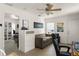 Comfortable living room with sofa, storage, and access to bedroom, offers a relaxed living space at 7003 Cupseed Ln, Harmony, FL 34773