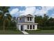 Charming two-story home with a manicured lawn, showcasing its inviting facade and well-maintained landscaping at 7151 Rosy Sky Aly, Orlando, FL 32829