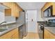 Efficient kitchen featuring modern appliances, granite countertops, and ample cabinet space at 758 E Michigan St # 203, Orlando, FL 32806