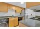 Efficient kitchen featuring modern appliances, granite countertops, and ample cabinet space at 758 E Michigan St # 203, Orlando, FL 32806
