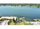Stunning lake view featuring waterfront condos, a private dock, lush greenery and a decorative water fountain at 758 E Michigan St # 203, Orlando, FL 32806