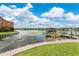 Stunning lake view featuring a gazebo on a dock, a fountain, and well-manicured lawns at 758 E Michigan St # 203, Orlando, FL 32806