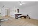 Bright living room with modern flooring, neutral walls, and an open layout to the kitchen at 758 E Michigan St # 203, Orlando, FL 32806