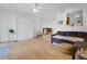 Bright living room with modern flooring, neutral walls, and an open layout to the dining area at 758 E Michigan St # 203, Orlando, FL 32806