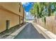Scenic path to the lake, lined with lush trees and a wooden fence, leading to waterfront access at 758 E Michigan St # 203, Orlando, FL 32806
